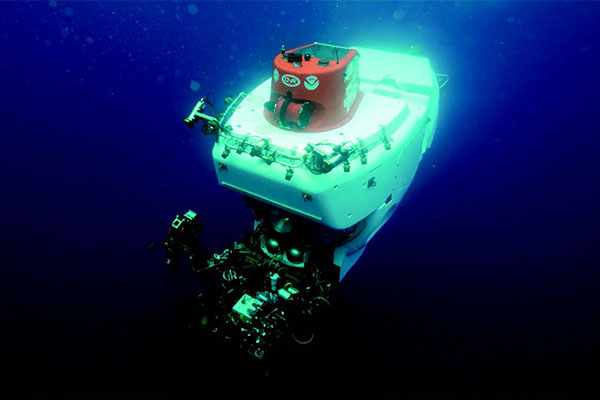 The deep submergence vessel Alvin descending into the ocean.
